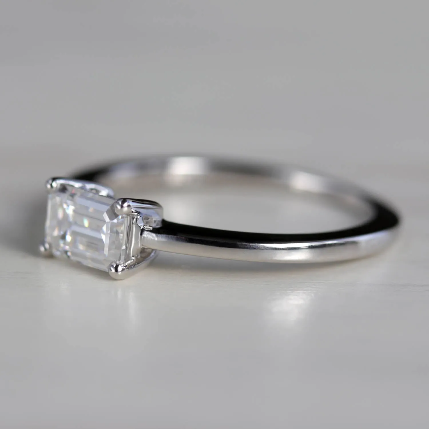 Emerald Cut East-West Basket Solitaire Engagement Ring