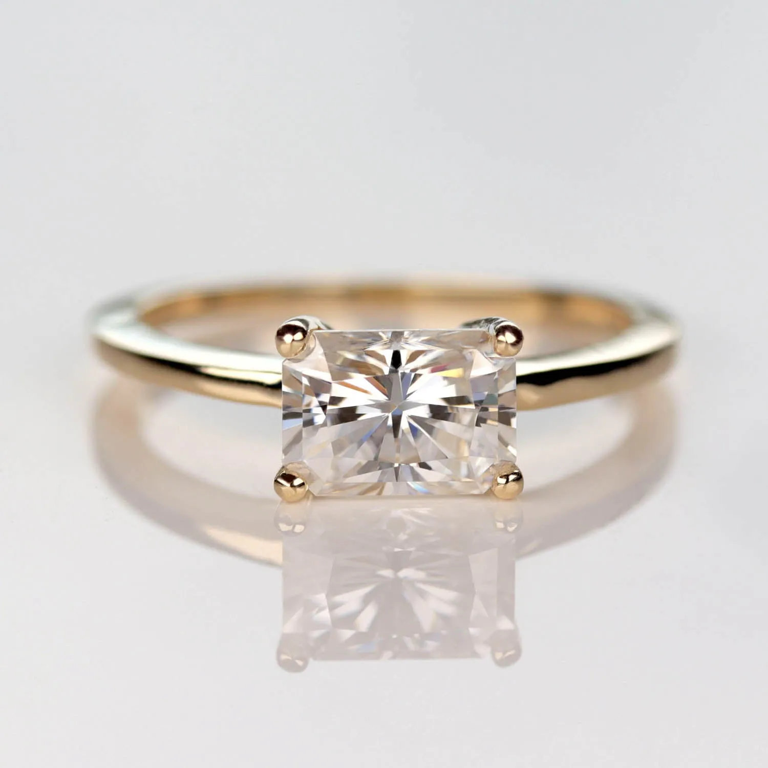 Emerald Cut East-West Basket Solitaire Engagement Ring