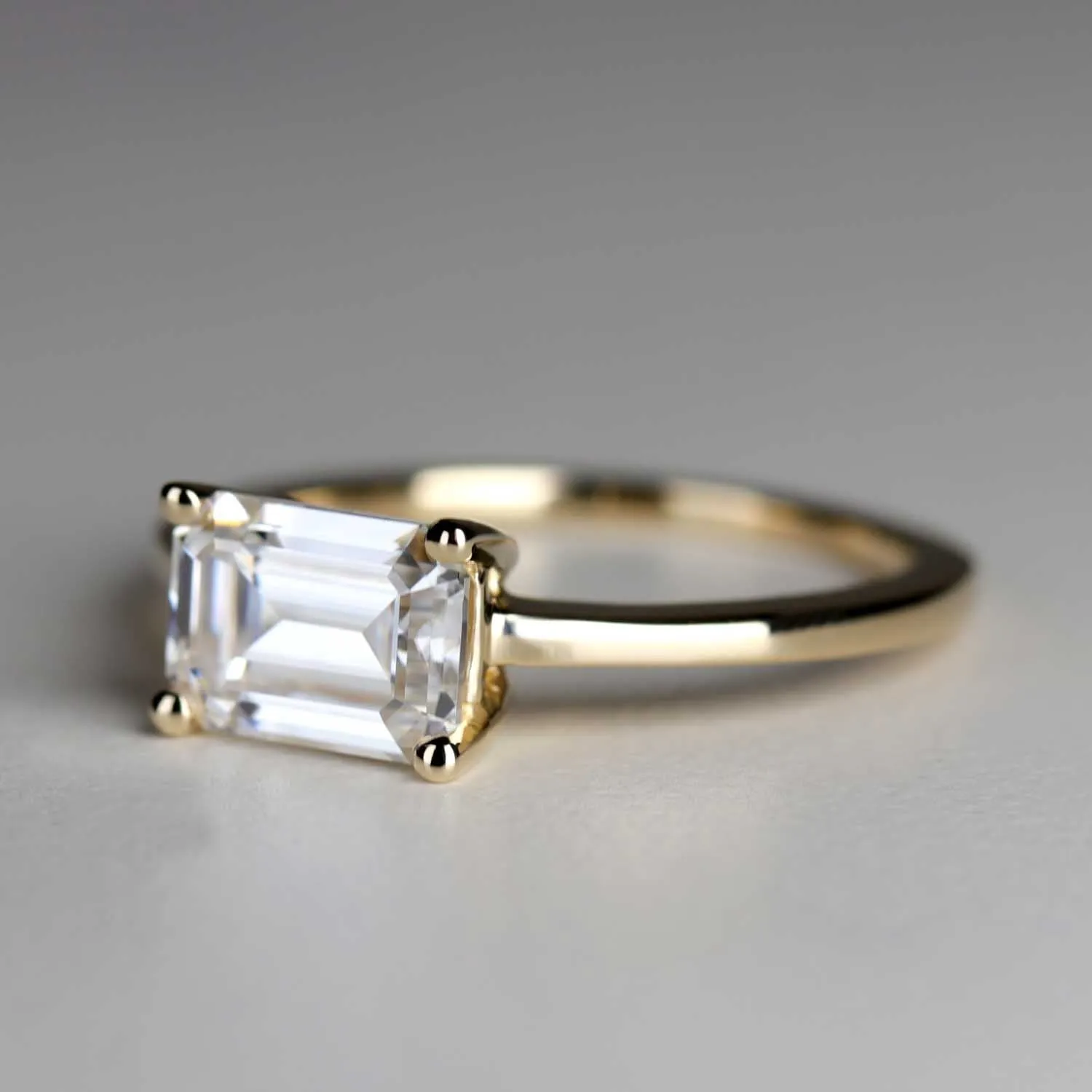 Emerald Cut East-West Basket Solitaire Engagement Ring